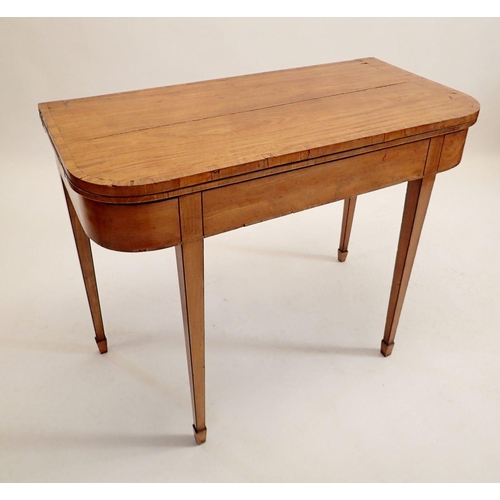 1200 - An early 19th century mahogany fold top card table on square tapered supports