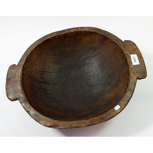 1208 - A large wooden two handled rustic bowl, 38cm diameter