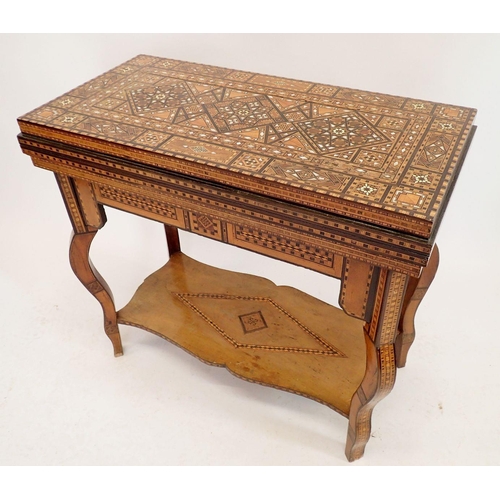 1209 - A Damascus marquetry fold top games table with card baize, backgammon and chess boards