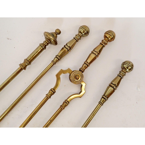 1215 - A brass matched four piece fireside set