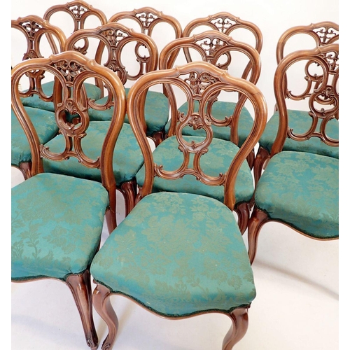 1218 - A set of ten Victorian mahogany dining chairs with carved scrollwork backs and cabriole supports