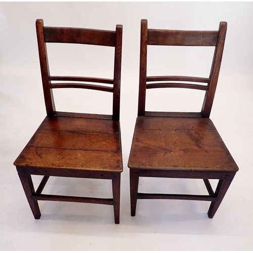 1220 - A matched set of four Georgian oak and elm slat back chairs with solid seats and two bar back chairs