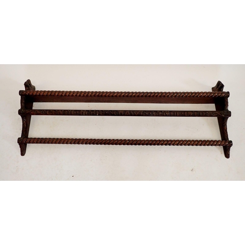 1225 - A Victorian oak plate rack carved stylised bird brackets to sides, the front with script 'Gentil Her... 