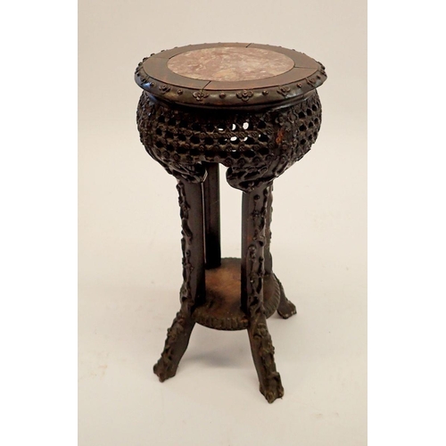 1234 - A Chinese small hardwood jardiniere stand with inset marble top and all over carved prunus decoratio... 