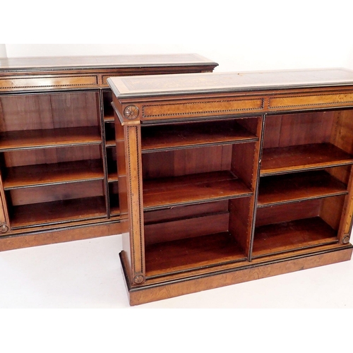 1235 - A pair of fine of Victorian oak and ebonized dwarf bookcases with leather inset tops, adjustable she... 