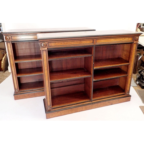 1235 - A pair of fine of Victorian oak and ebonized dwarf bookcases with leather inset tops, adjustable she... 