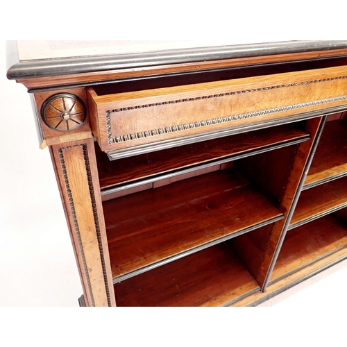 1235 - A pair of fine of Victorian oak and ebonized dwarf bookcases with leather inset tops, adjustable she... 