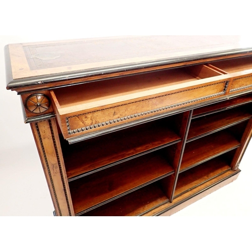 1235 - A pair of fine of Victorian oak and ebonized dwarf bookcases with leather inset tops, adjustable she... 