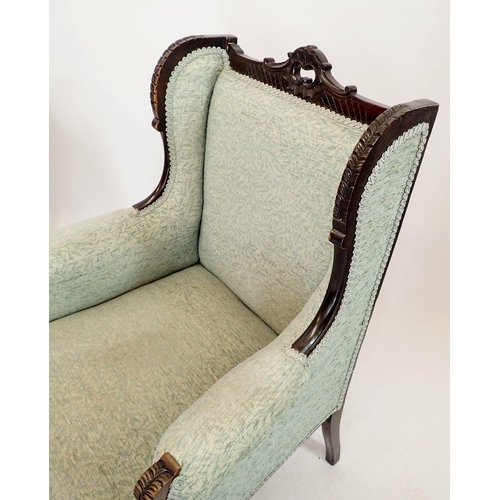 1249 - A pair of Victorian mahogany framed wing armchairs with carved rococo style decoration