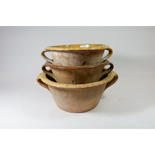 1254 - Three various glazed terracotta bread crocks, 32cm diameter