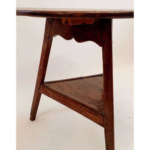 1258 - An 18th century elm cricket table on triangular supports with triangular undertier, 79cm diameter, 7... 