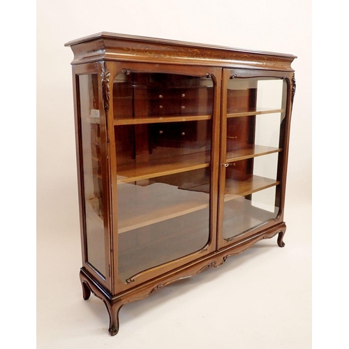 1275 - An early 20th century mahogany two door display cabinet with satinwood and penwork marquetry to frie... 