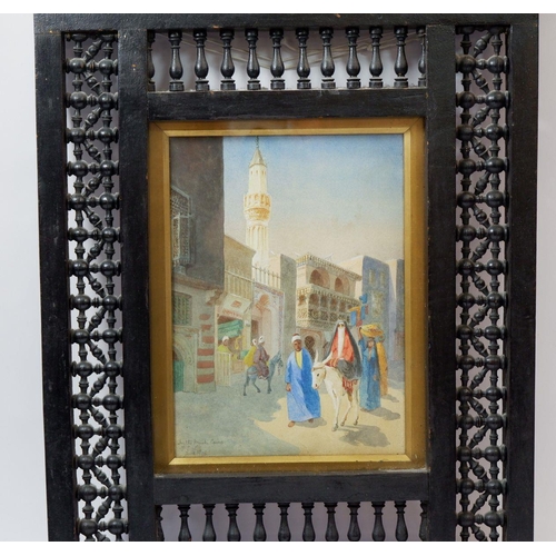 1280 - A watercolour 'In The Muski, Cairo, Egypt', monogrammed F.S.L and dated 1908 in decorative ebonised ... 