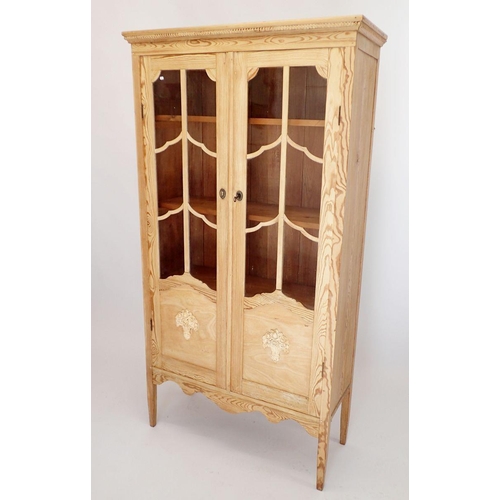 1286 - A late 19th century French pine two door bookcase or display cabinet with applied basket of flowers ... 