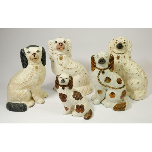 63 - Four various Staffordshire spaniels plus one a/f, largest 25cm tall