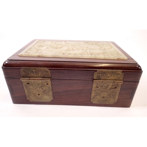 654 - A mahogany oriental card box with green stone inset lid, 15 x 11cm