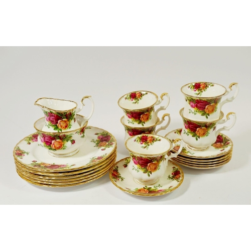 68 - A Royal Albert Country Roses set of five coffee cups, six saucers, six tea plates, milk and sugar