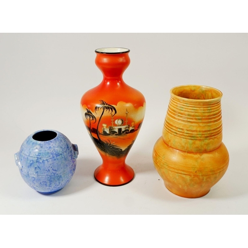 72 - Two 1930's pottery vases and a Bow orange Art Deco vase decorated Arabian scene, tallest 28cm