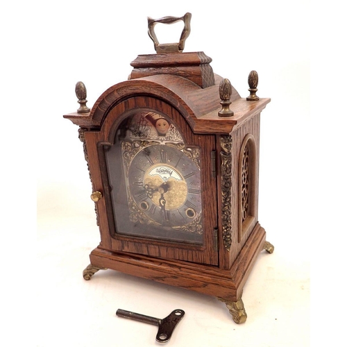 738 - An oak small Wuba bracket style mantel clock, 19cm tall