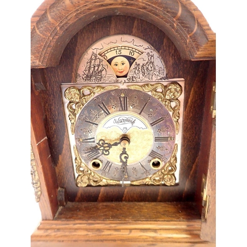 738 - An oak small Wuba bracket style mantel clock, 19cm tall