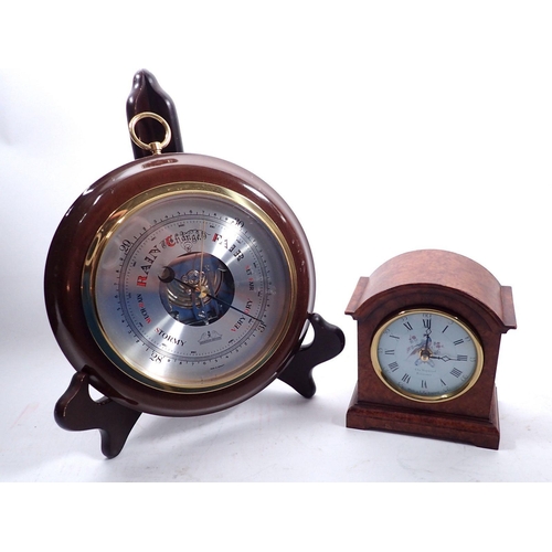 746 - A walnut veneered mantel clock, 12.5cm tall plus a circular barometer, 19cm