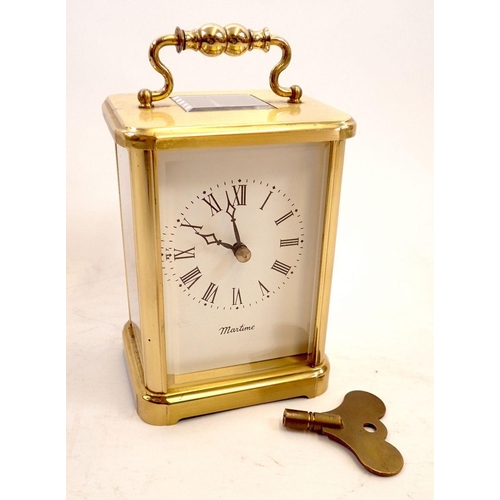 747 - An English made eight day maritime brass carriage clock with key, 13cm tall