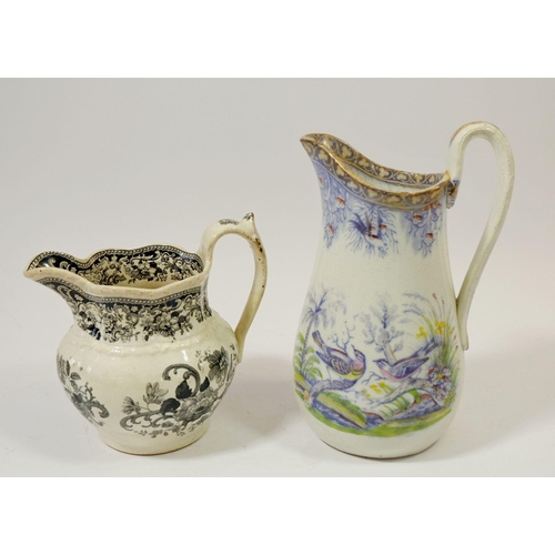 75 - A Swansea jug by J Evans & Co 'Birds' and another black floral printed Swansea jug