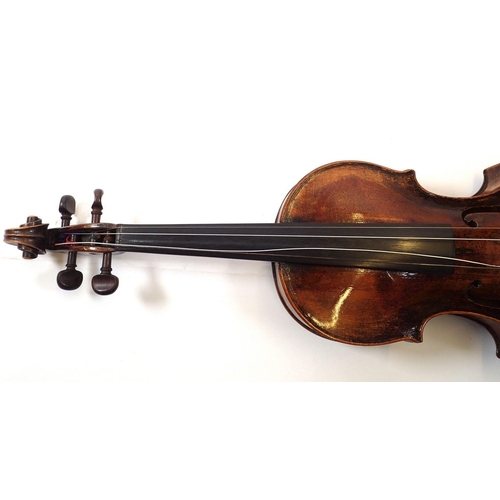 757 - An 18th century French violin with two piece back and later German scroll, cased - 14