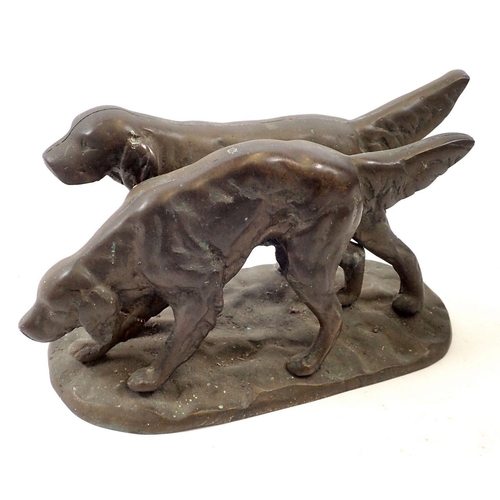 760 - A heavy bronze finish group of two retrievers, 26cm long