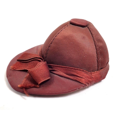 766 - A silk jockey hat pin cushion, 7cm