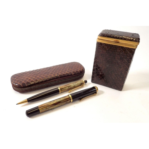 776 - A snakeskin cigarette box and a snakeskin cased ink pen and propelling pencil