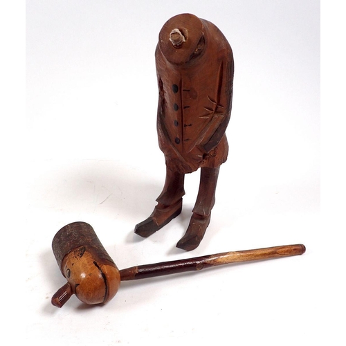 799 - A collection of eight pipes including a carved man concealing a pipe standing 17cm tall