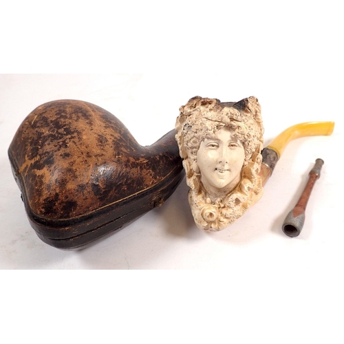 806 - A 19th century Meerschaum pipe in form of a ladies head, cased and a cigarette holder