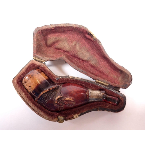 807 - A Meercham pipe in form of a leg with garter, a/f and three antique terracotta pipe bowls