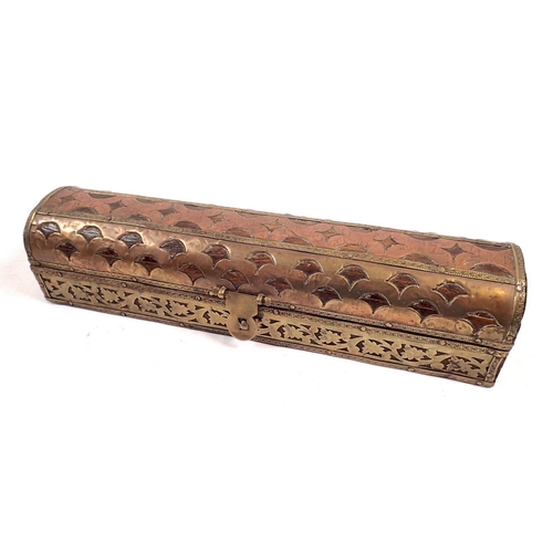 811 - An Arabic brass and copper clad box containing sandalwood, 23cm