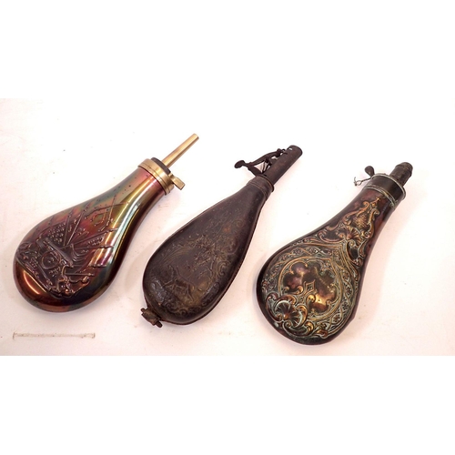 820 - Two Victorian copper powder flasks plus one leather powder flask