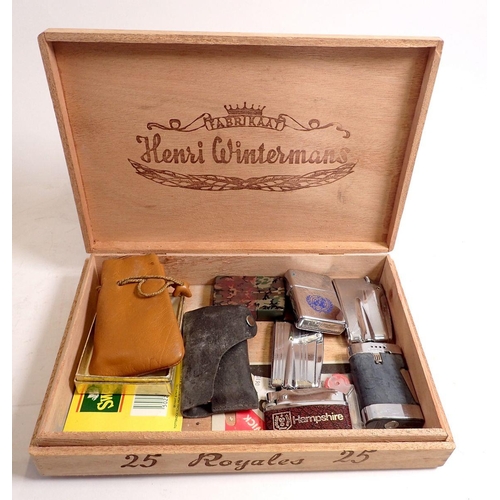 823 - A Henri Wintermans cigar box with a selection of lighters including Ronson, Zippo, Colibri etc.