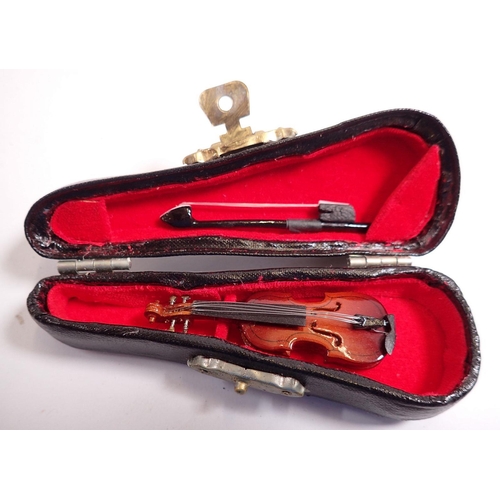 825 - A miniature violin and cello, cased - cello 15cm long