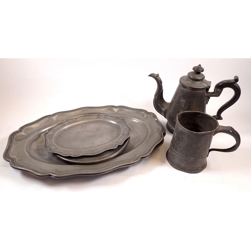 852 - A collection of antique pewter platters, tea pot etc.