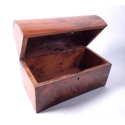 854 - A burr wood dome top box with key, 22cm wide