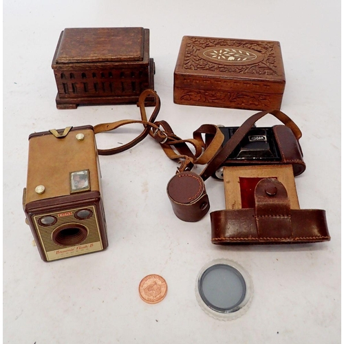 855 - A Kodak folding box camera and two wooden boxes