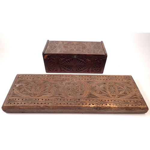 863 - A large gothic design cribbage board, 45cm long together with a gothic carved wooden box