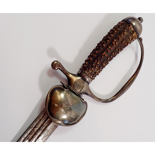 1163 - A fine 18th century hunting sword, the stag horn handle with silver mounts and indistinct stamped ha... 