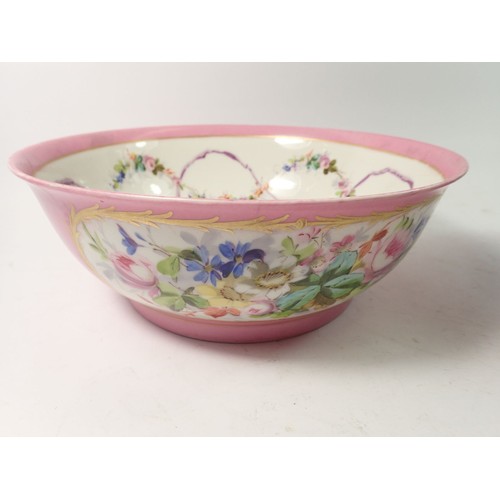 51 - A Sevres style bowl painted flowers to interior and rococo style scene to exterior, 27cm diameter