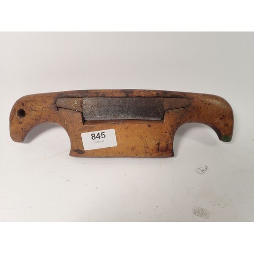 845 - An antique fruitwood convex spoke shave, 28cm wide