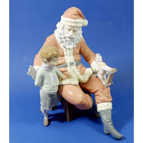 10 - A Lladro figure 5971 'A Special Toy' Father Christmas with boy and toy, unboxed -  good condition, d... 