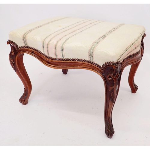 1061 - A Victorian mahogany framed stool with carved decoration and cabriole supports