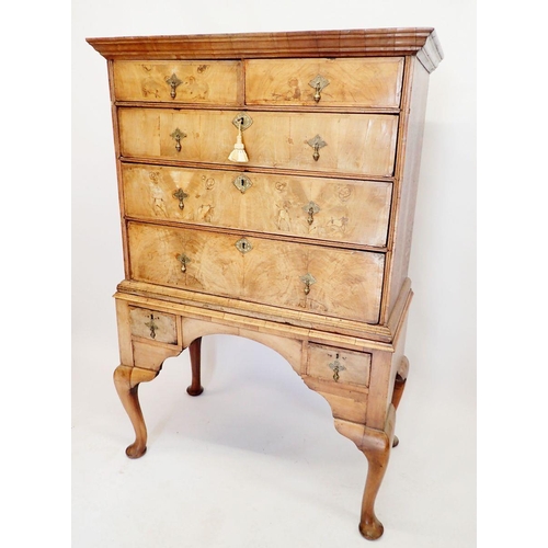 1062 - An early 18th century walnut chest on stand with two short drawers over four long all on cabriole su... 