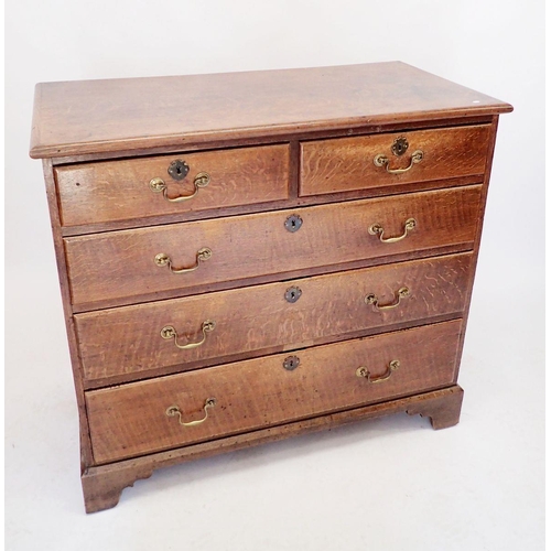 1070 - A Georgian oak chest of two short and three long drawers with brass handles, 109cm wide