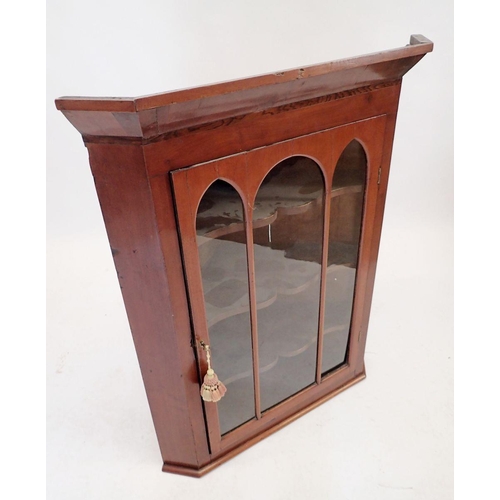 1073 - A 19th century mahogany corner cabinet with triple Gothic arch glazed door